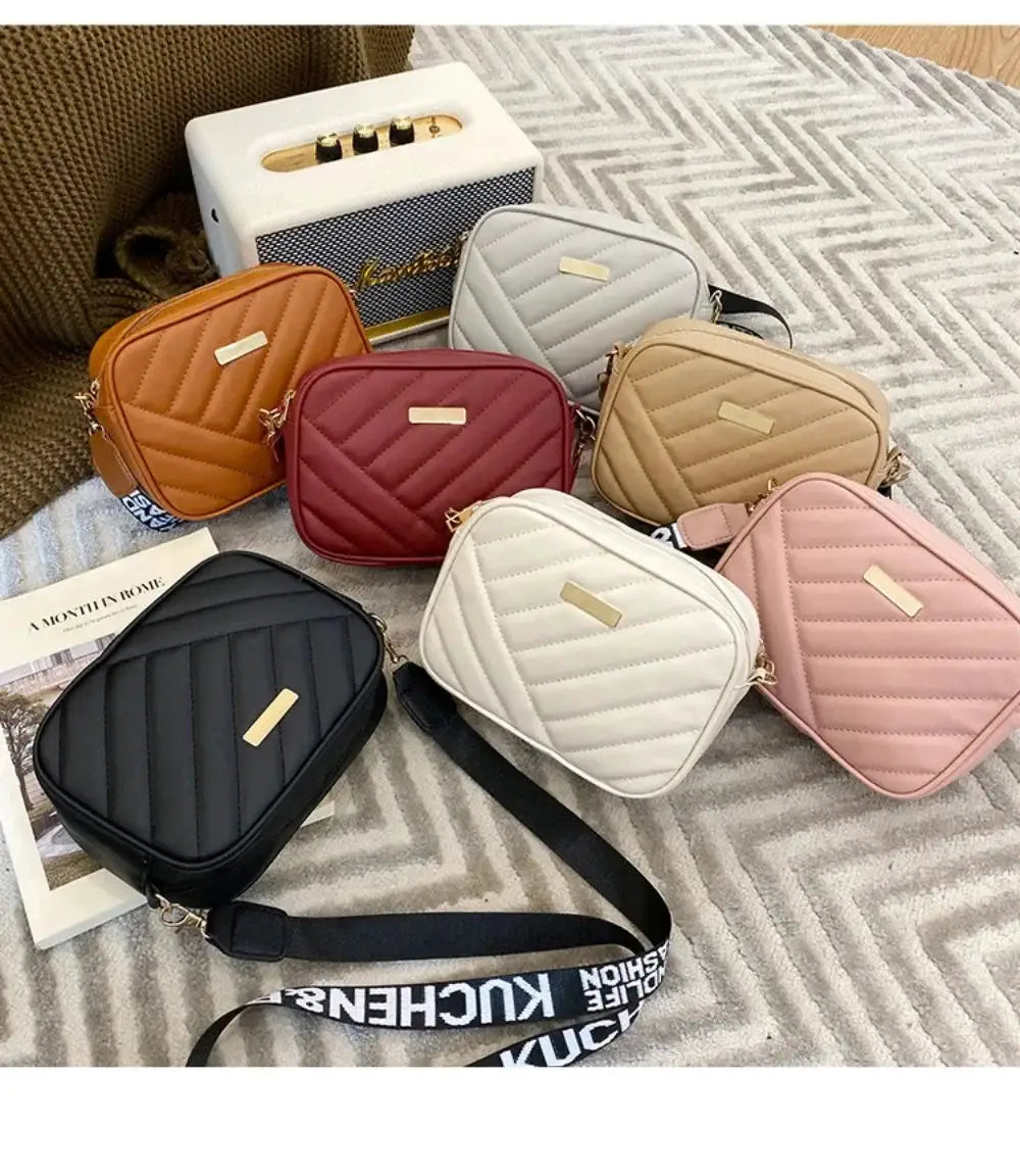 Set of seven PU-quilted crossbody shoulder bags in black white pink beige tan orange and burgundy with gold plaques