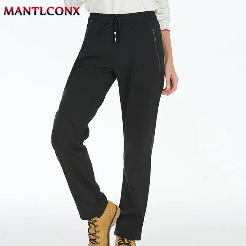 Men's black jogger sweatpants with elastic waist, zip pockets, MANTLCONX logo