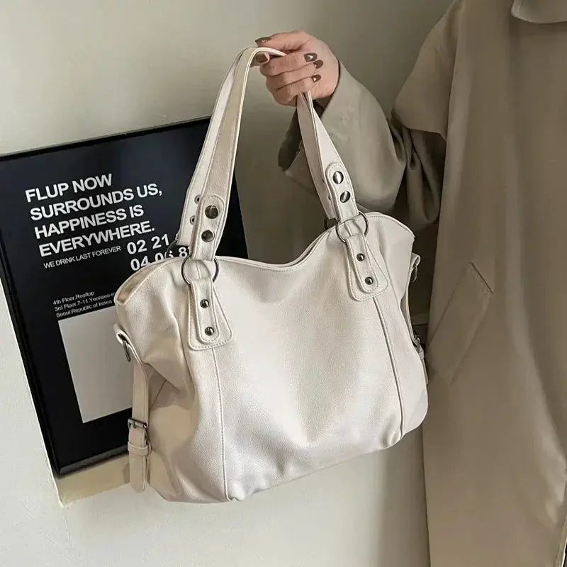 Soft interior compartment shoulder bag in cream PU leather by Simples Market with dual top handles