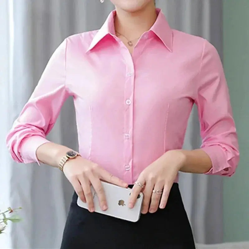 Pink women's long-sleeve button-down blouse with white collar for office wear.