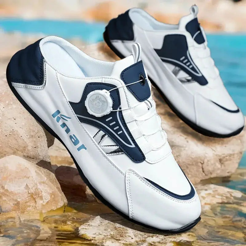 Pair of Knar white and navy men's running shoes with dial lace system.