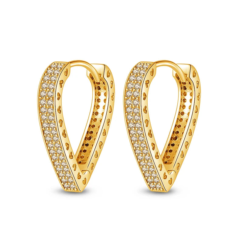 Gold-tone hoop earrings with pavé crystals and inner heart-cut detailing, pair by Simples Market