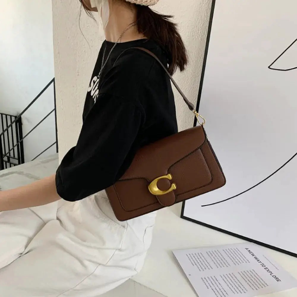 Double-Strap Small Square Crossbody Bag in brown with gold-tone buckle by Simples Market