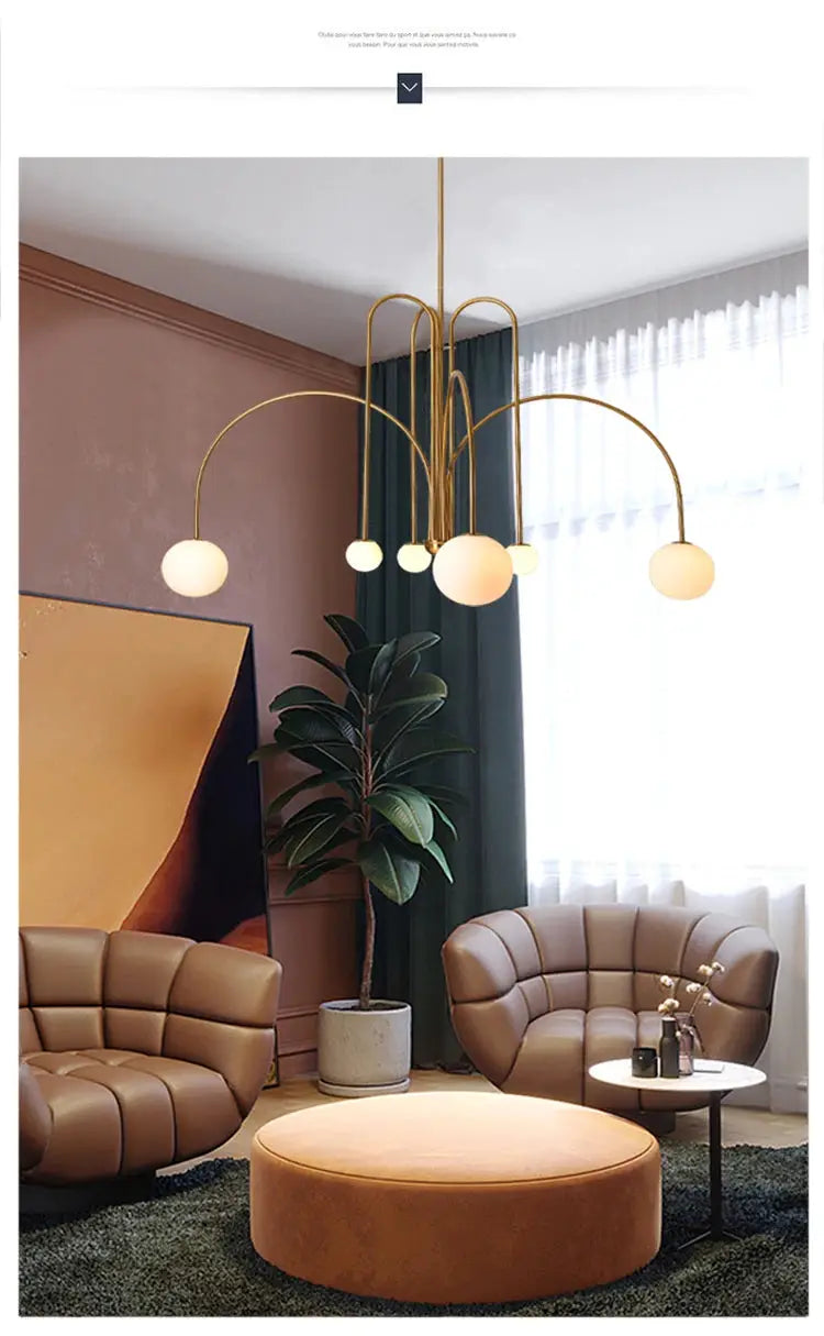 Nordic minimalist pendant light in gold with globe bulbs; modern chandelier for living room.