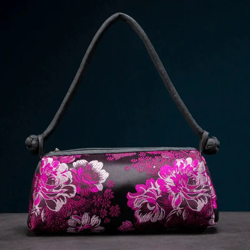 Shoulder bag with pink magenta floral embroidery on black satin
