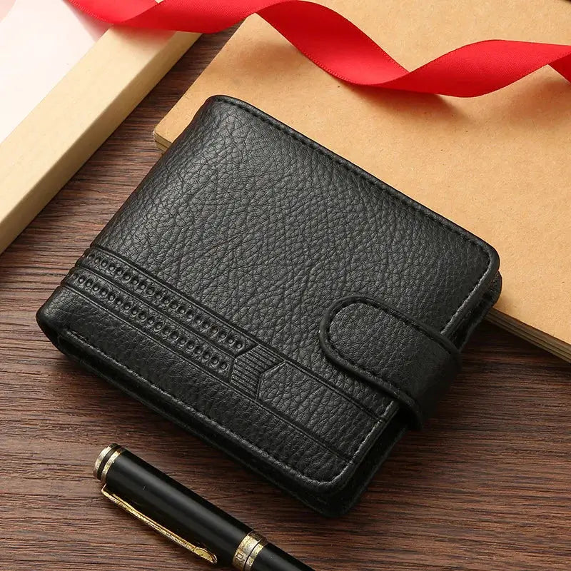 Men's black leather bifold wallet with strap closure and card slots.