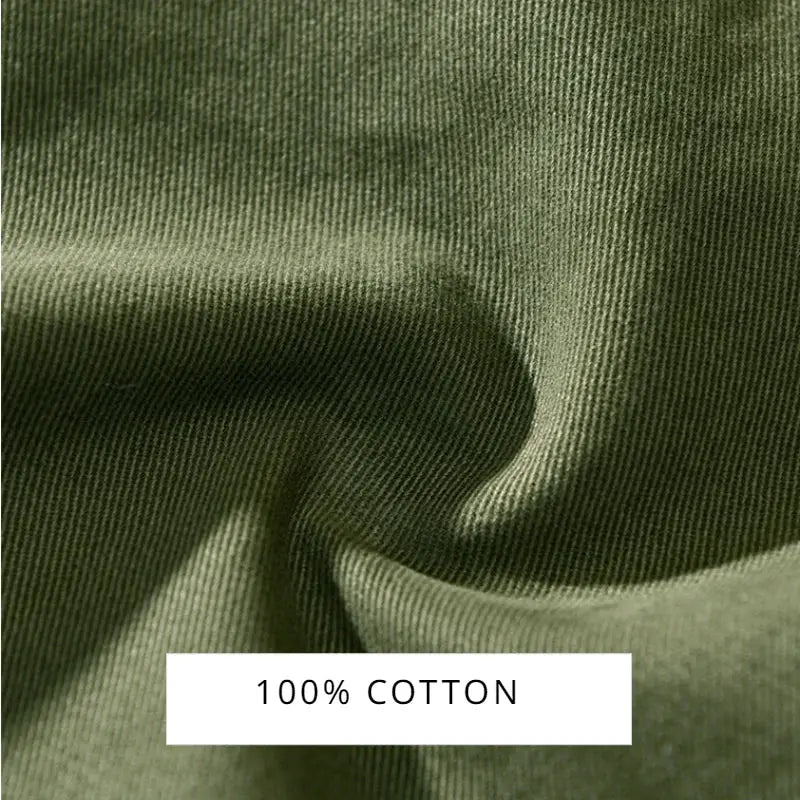 Men's cargo pants fabric in olive green, 100% cotton close-up