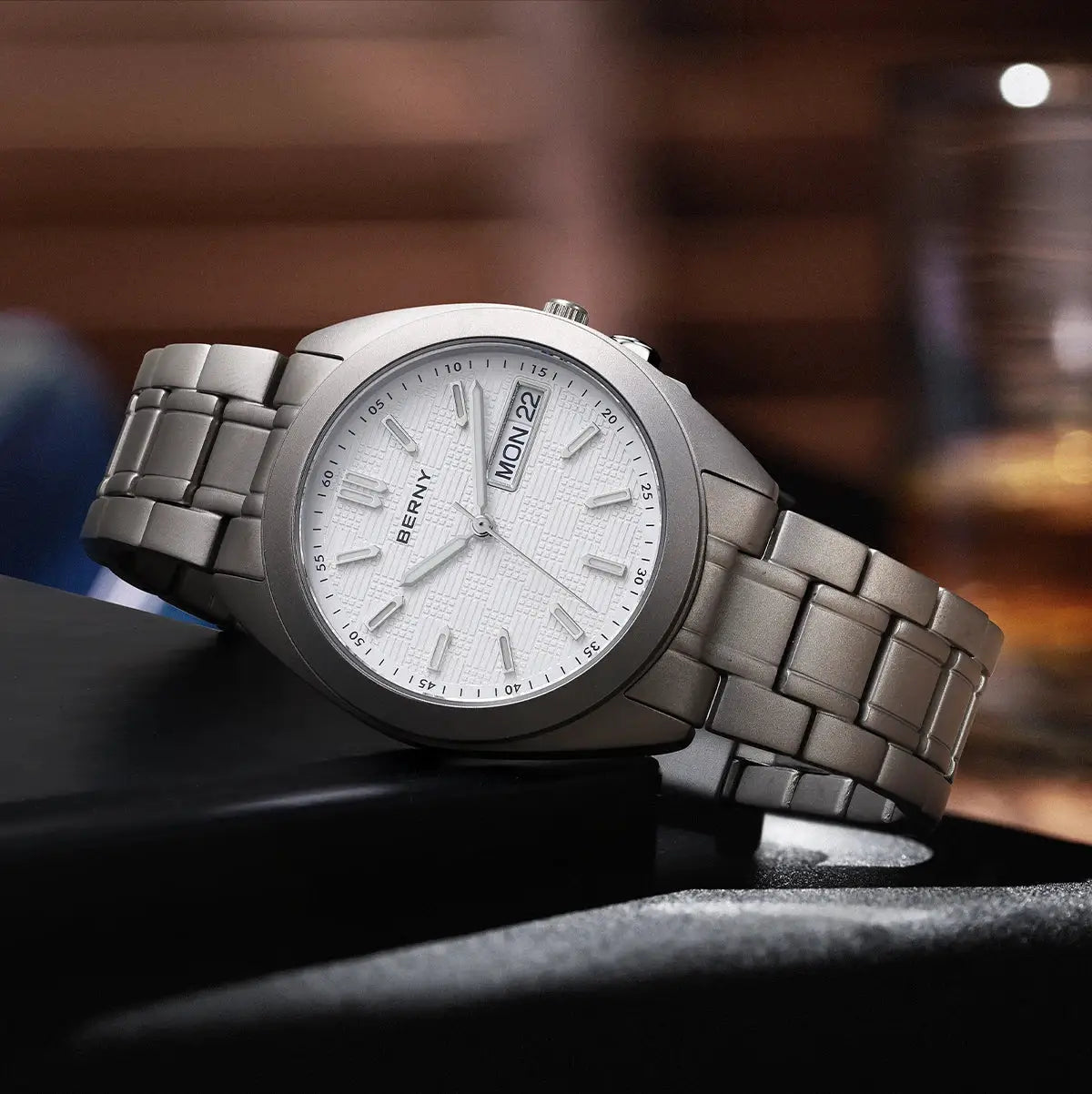 BERNY men's titanium wristwatch; 38mm silver-tone case and bracelet with white textured dial and day-date window