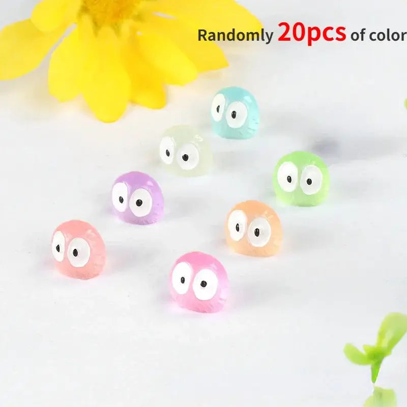 Colorful round car interior ornaments with big cartoon eyes, 8 pieces shown