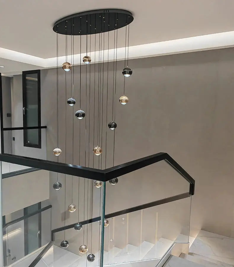 Simples Market modern pendant light with metallic orb pendants from a round canopy for living and dining areas.