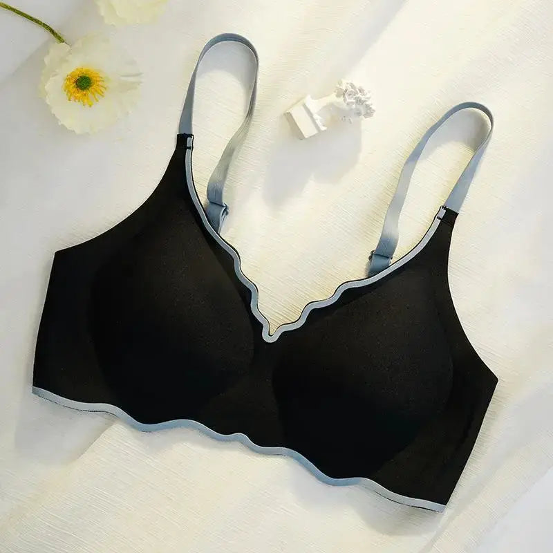 No Trace contrasting-color women's thin push-up bra, black cups with light-blue piping and scalloped edges