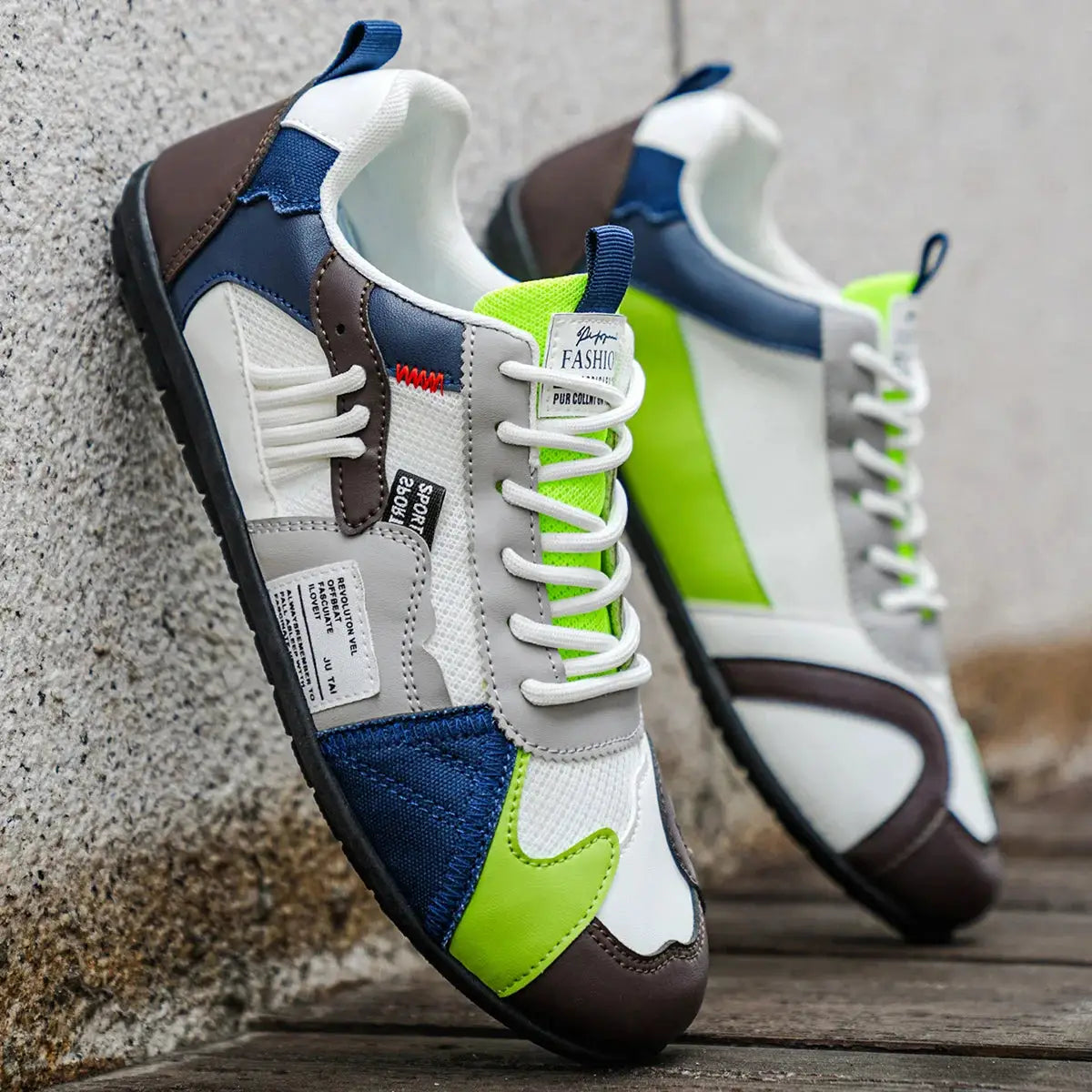 Pair of men's casual sport sneakers by Simples Market in white, gray, navy with neon green accents