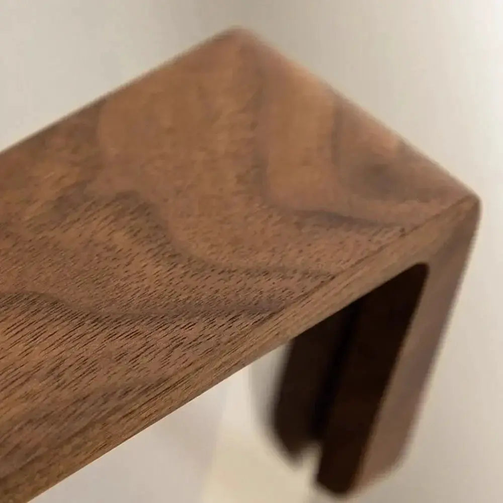 Walnut and beech wood photo frame for desktop display with rounded corners and warm natural grain texture.