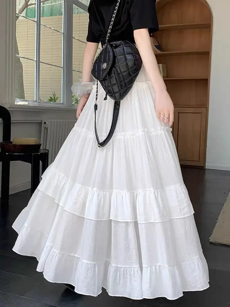 White tiered ruffle-hem chiffon maxi skirt, high-waisted and flowy
