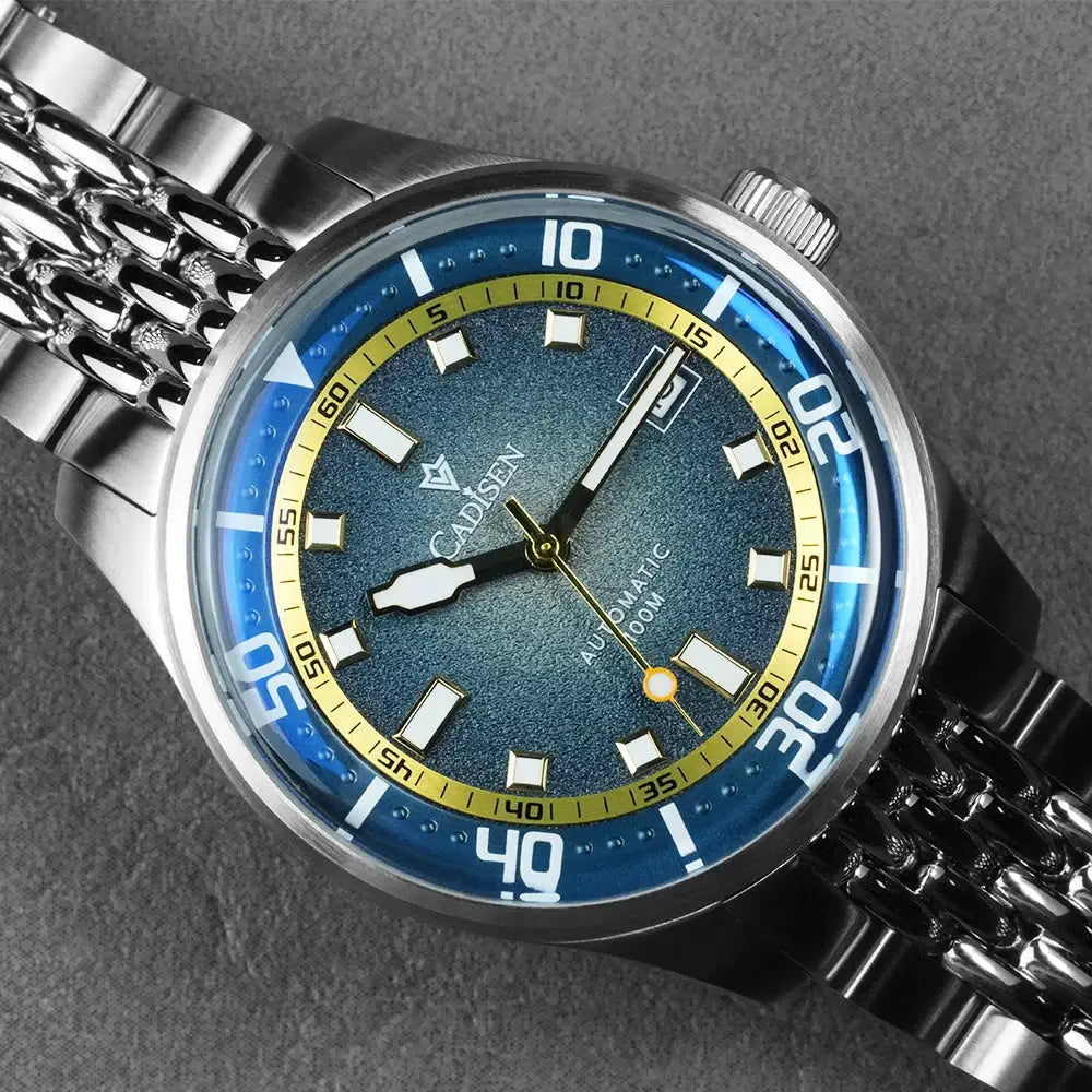CADISEN automatic mechanical watch with blue dial, yellow inner ring, and stainless steel bracelet