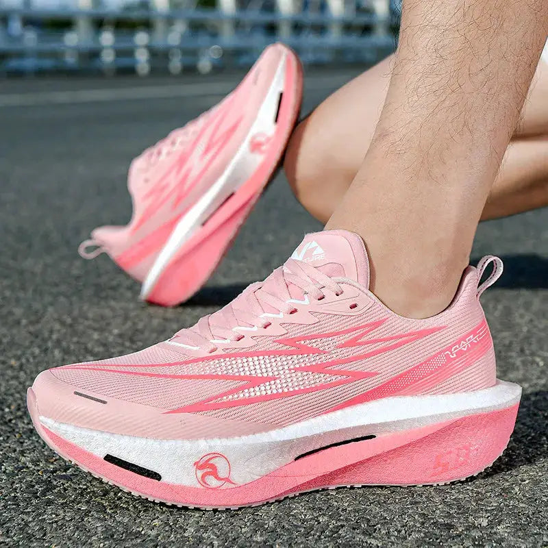 Pink women's running sneakers with breathable mesh and air-cushioned sole (pair shown)