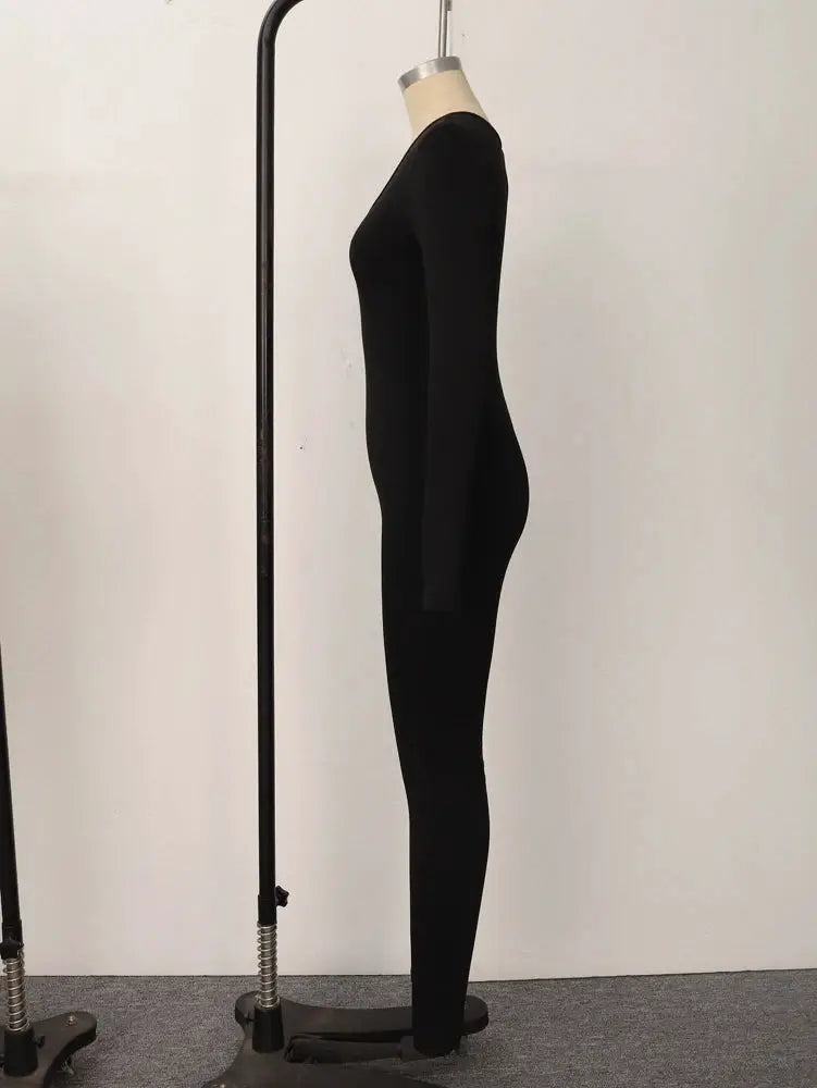 Women's black solid long-sleeve skinny jumpsuit on dress form
