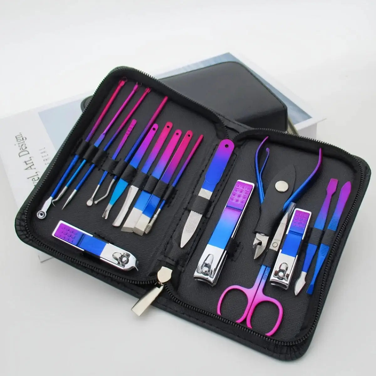 Stainless steel manicure and pedicure kit in a black travel case with gradient purple tools.
