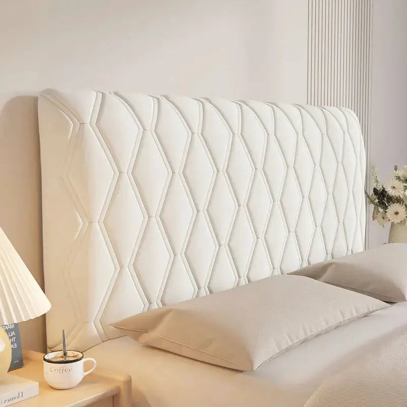 White velvet headboard cover with quilted diamond pattern for bed