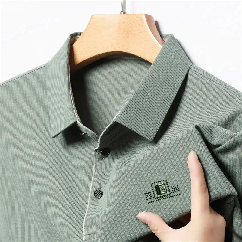 Men's polo shirt sage green with badge logo, breathable knit fabric, short sleeves.