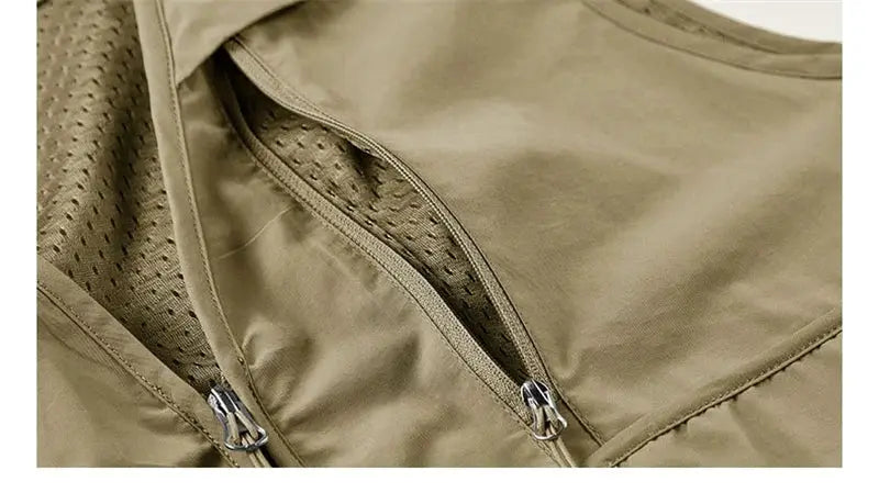 Khaki men's sleeveless vest with zip pockets and breathable mesh lining.
