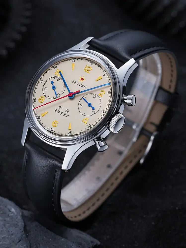 Seagull 1963 pilot wristwatch by Simples Market; beige dial, blue hands, red chronograph, black leather strap.