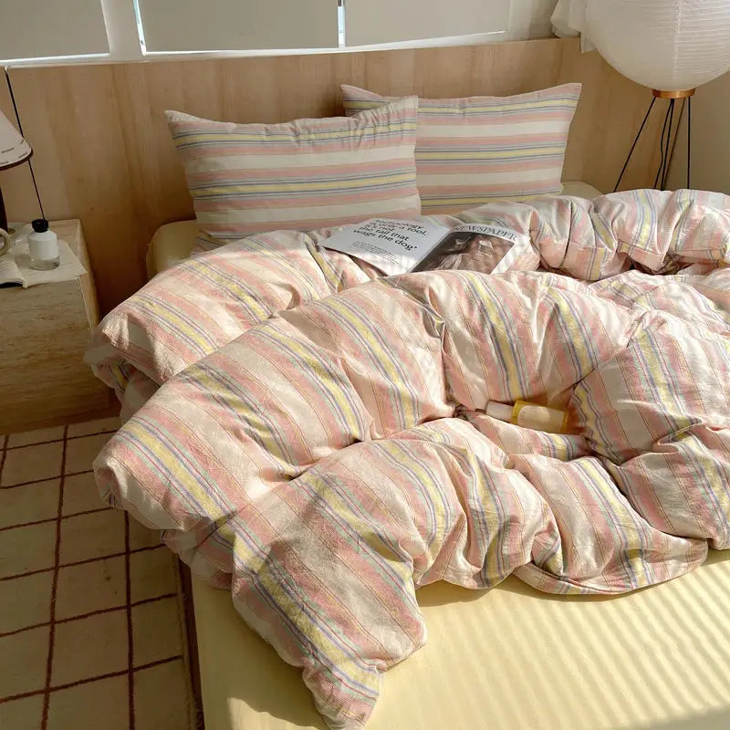 Duvet cover bedding set by Simples Market; striped 100% cotton with two pillowcases in pastel pink, yellow, blue