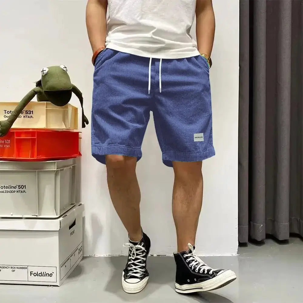 Men's blue corduroy shorts with elastic drawstring waist, knee-length casual basketball-style shorts
