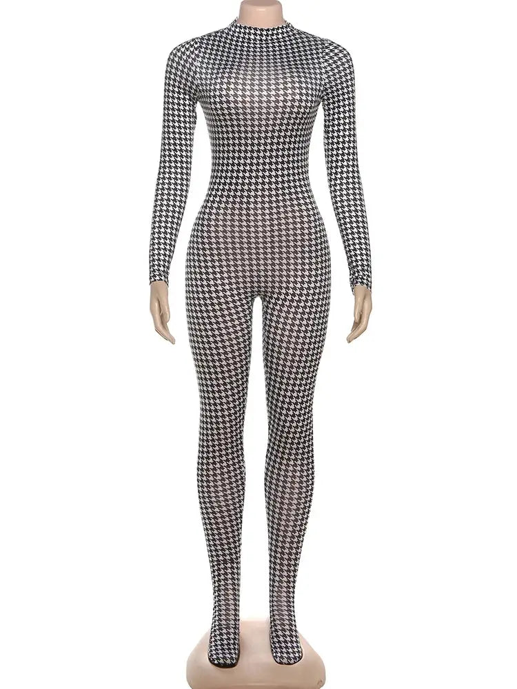 Houndstooth jumpsuit; black-and-white pattern, long sleeves.
