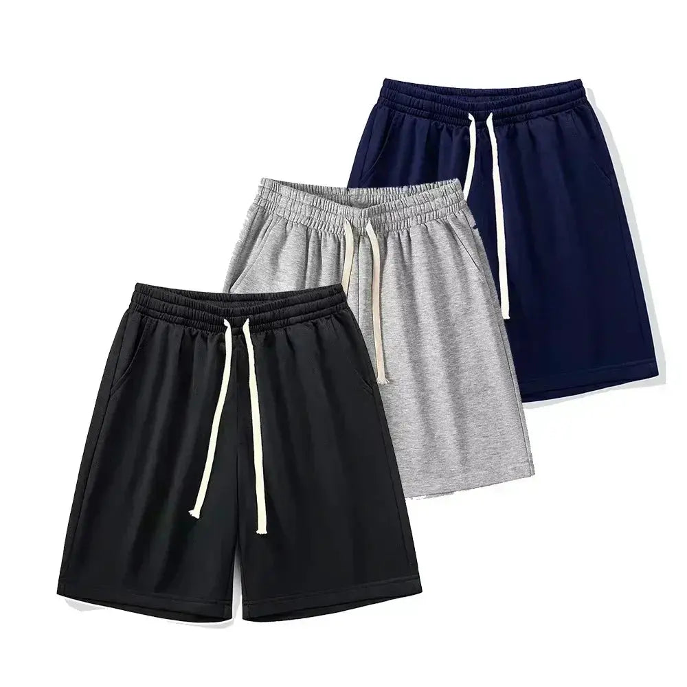 Three-pack casual cotton shorts in black, gray, and navy with drawstrings for men and women.