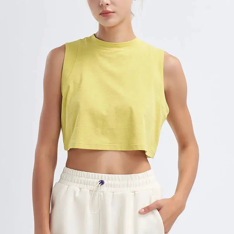 Womens yellow cropped sports vest top, seamless breathable quick-dry fabric for gym and yoga