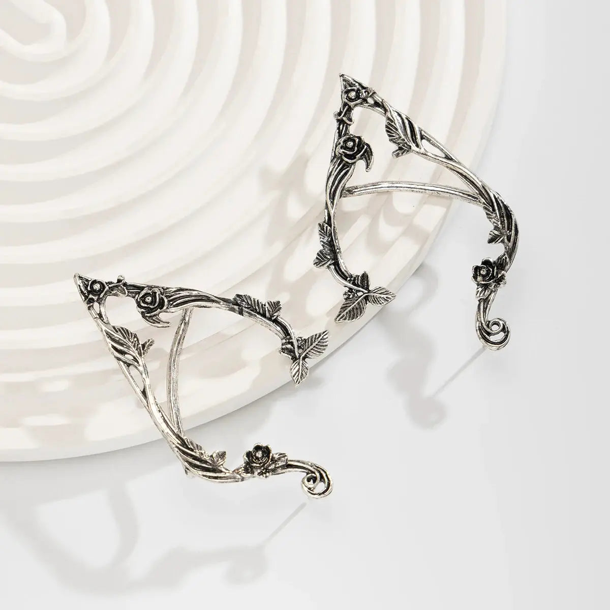 Elf flower leaf ear clips, non-pierced, by Simples Market in silver-tone metal with vine and rose details
