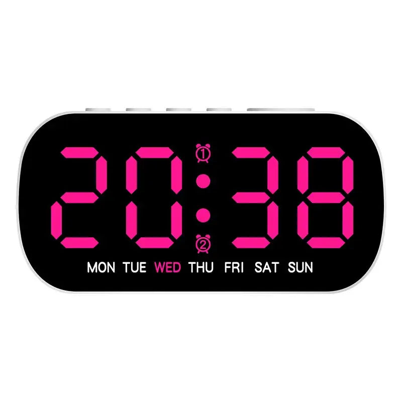 Digital alarm clock USB powered with pink LED time display and weekday row on a white rounded case.