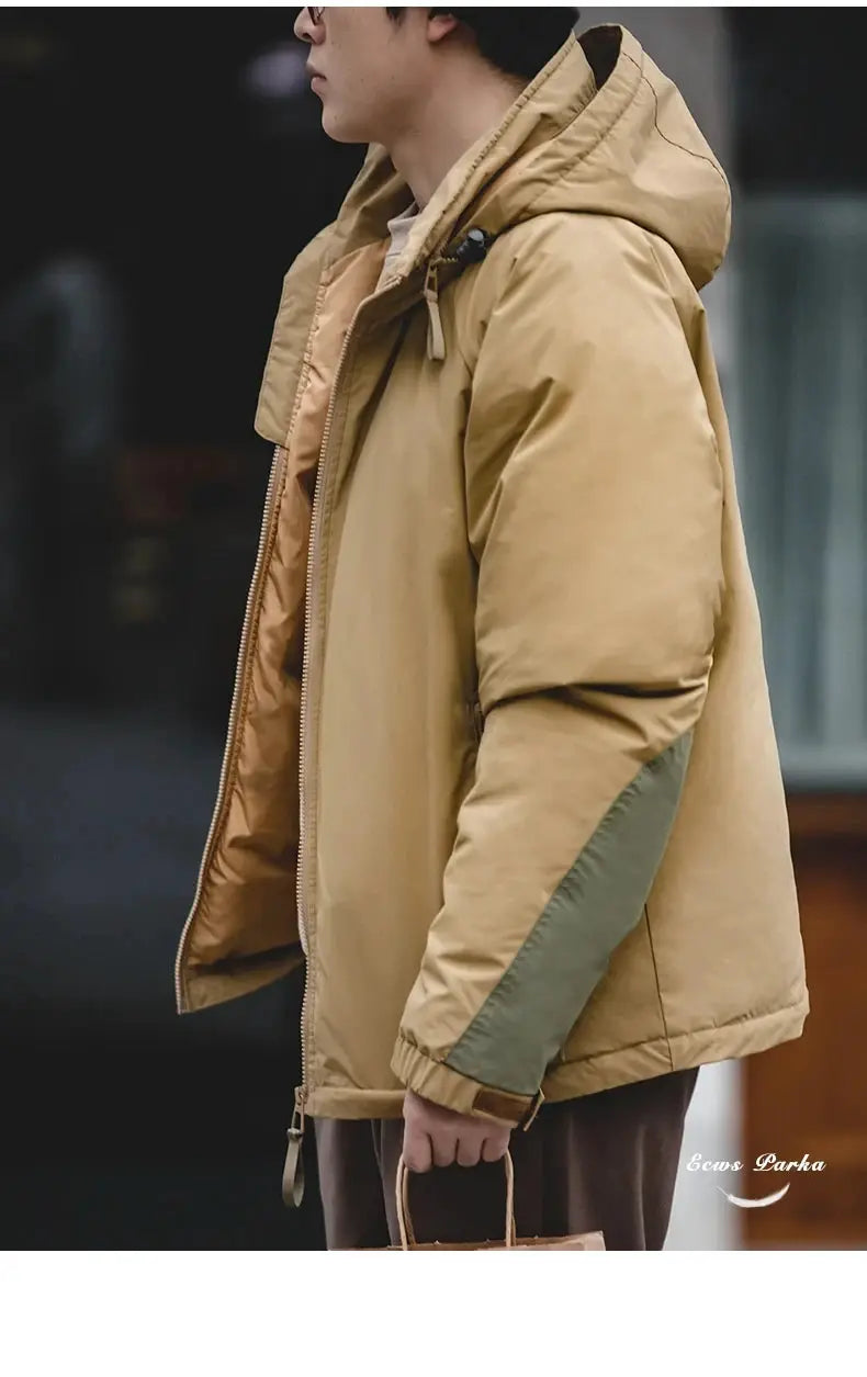 Men's hooded down jacket in tan with olive sleeve panels, front zipper, puffer parka