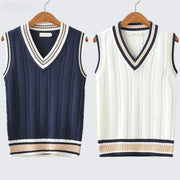 Two knitted sweater vests in navy and white with V-neck, striped collar and hem, cable-knit pattern.