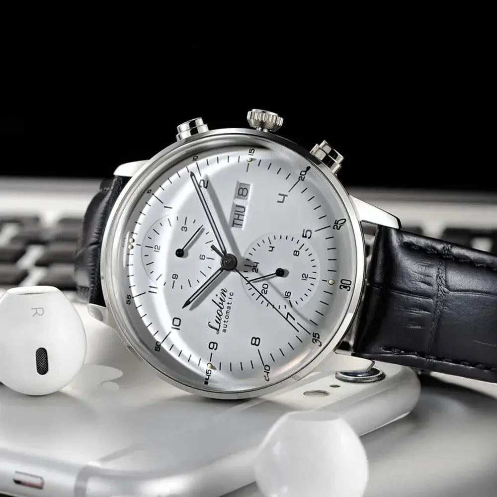 Mens mechanical automatic wristwatch with stainless steel case, black leather strap, chronograph subdials