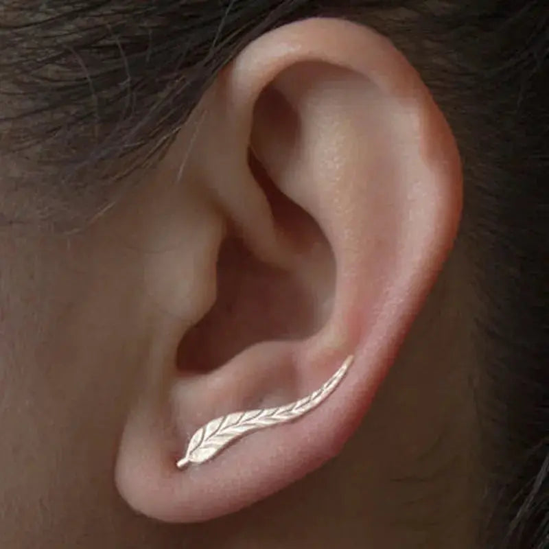 Leaf-shaped gold-tone ear stud earring with feather-inspired design for women