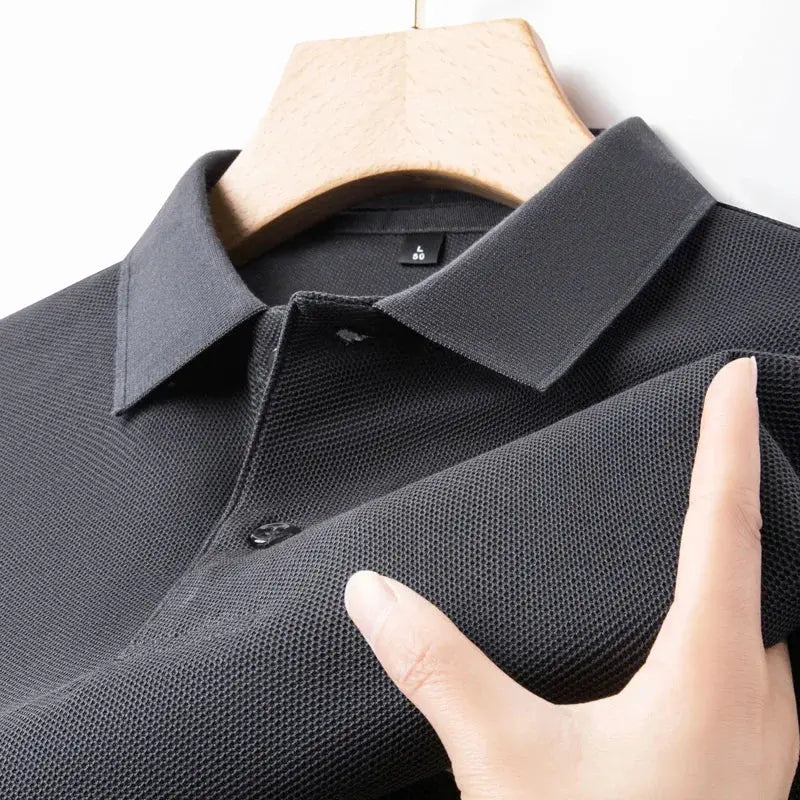 Men's black polo shirt, 100% cotton with breathable textured knit on hanger
