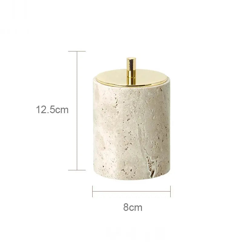 Beige travertine soap dispenser by Simples Market with gold pump; cylindrical 12.5 cm tall, 8 cm diameter