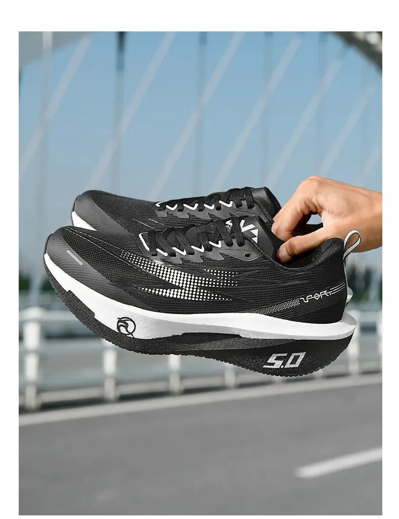 Pair of Simples Market black men’s running shoes with breathable upper and white midsole