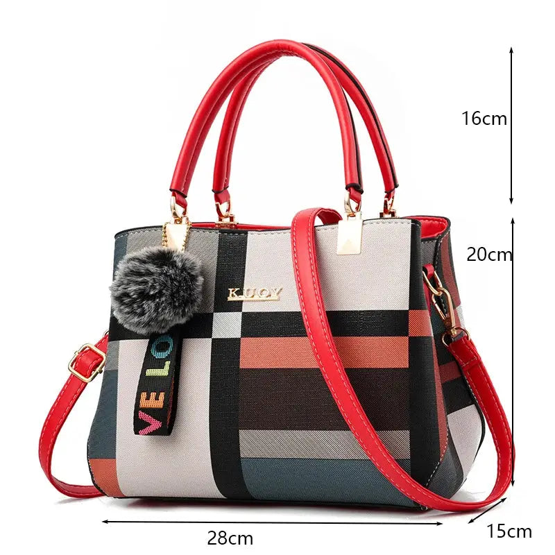 PU leather crossbody tote bag for women with multicolor geometric pattern and red handles and gold hardware.