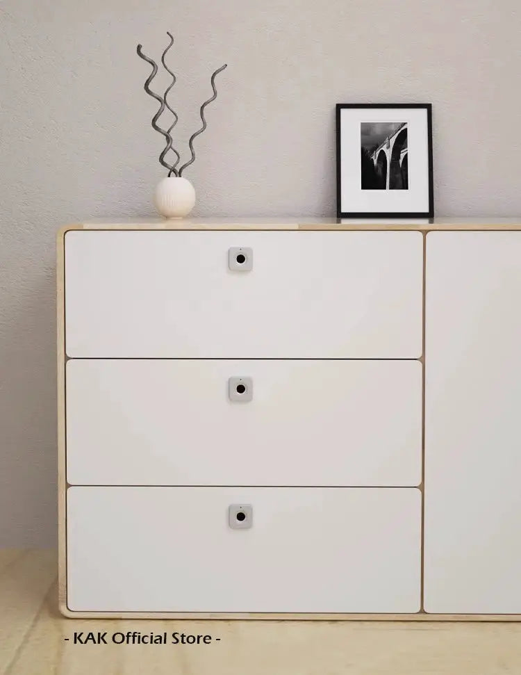 White dresser with KAK biometric fingerprint drawer locks; 30x30mm keyless locks on three drawers.