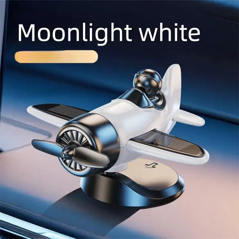Solar-powered rotating airplane dashboard ornament by Simples Market, moonlight white, 360° car decor