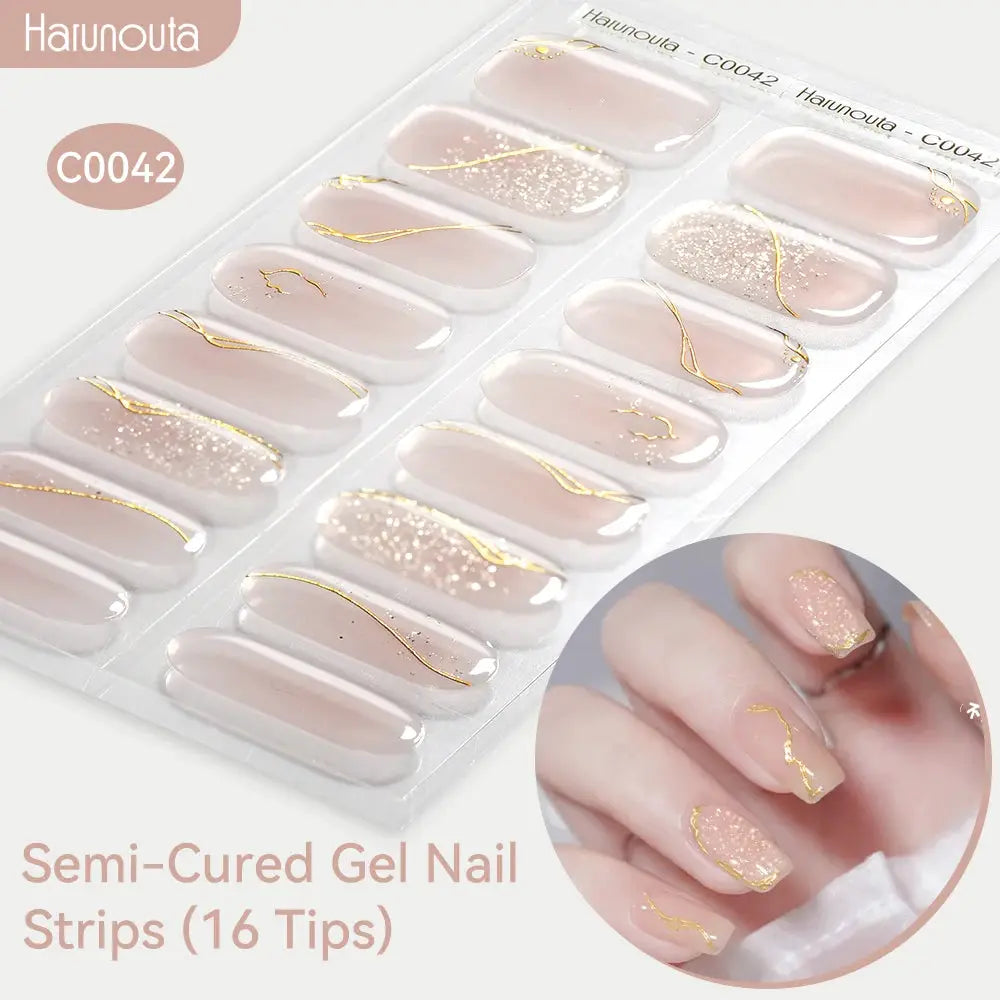 Semi-Cured Gel Nail Strips by Simples Market, 16 nude-pink gradient tips with glitter and gold foil accents