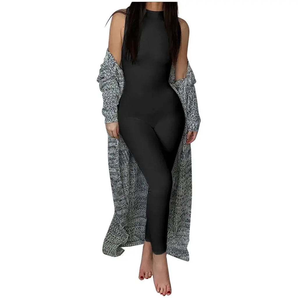 Simples Market women's black sleeveless pencil jumpsuit worn with a gray knit cardigan.