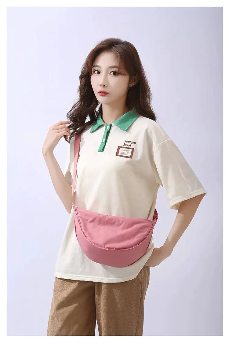 Simples Market pink nylon padded crossbody shoulder bag worn by model