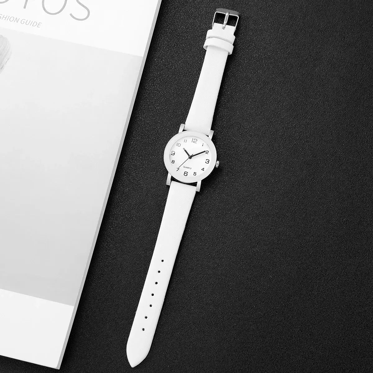 Wristwatch with white leather strap, silver case, Arabic dial, quartz movement