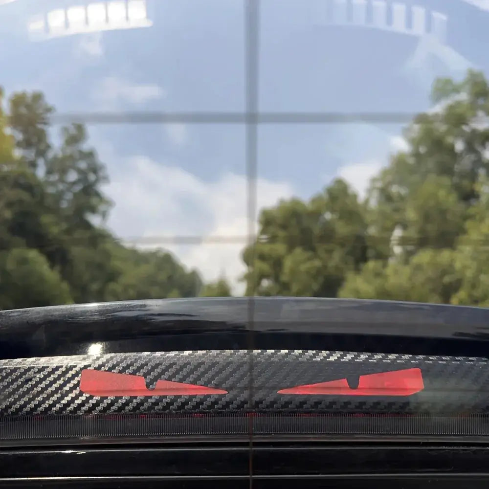 Monster Eyes Car Rear Light Sticker with carbon fiber pattern and red cartoon devil eyes decal