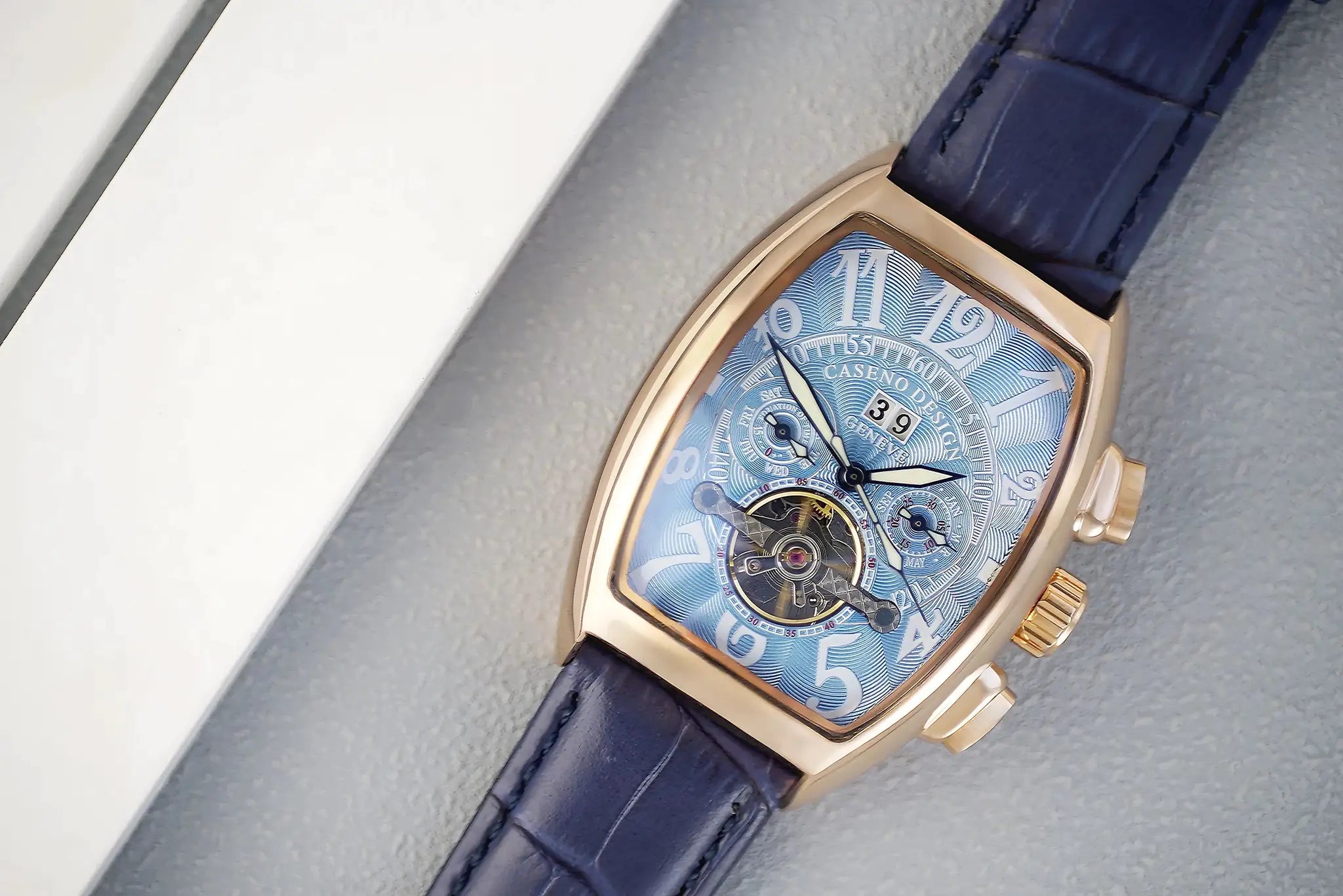Caseno luxury men's automatic tourbillon skeleton watch with blue dial, rose-gold case, navy leather strap