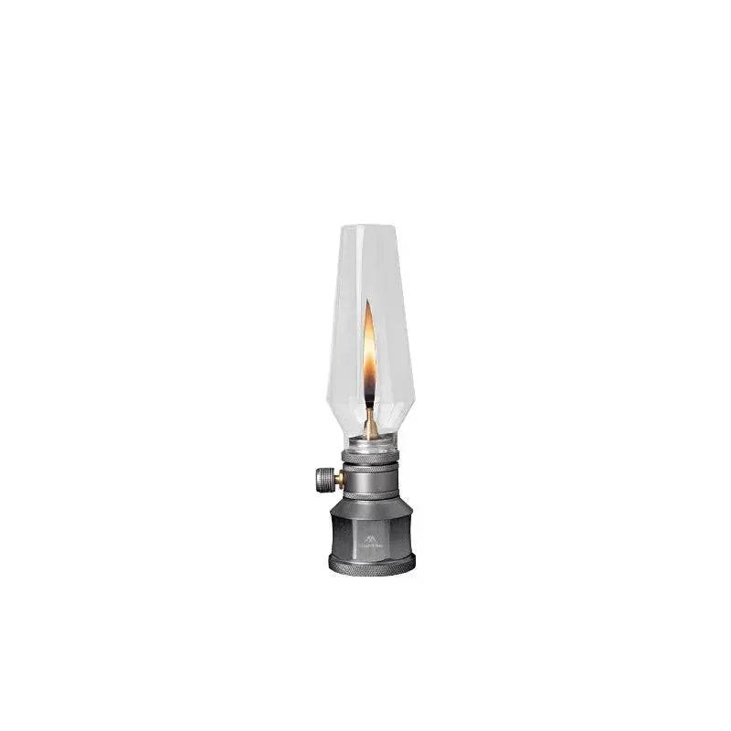 Simples Market outdoor gas lantern with faceted glass chimney and gray metal base, decorative ambient light